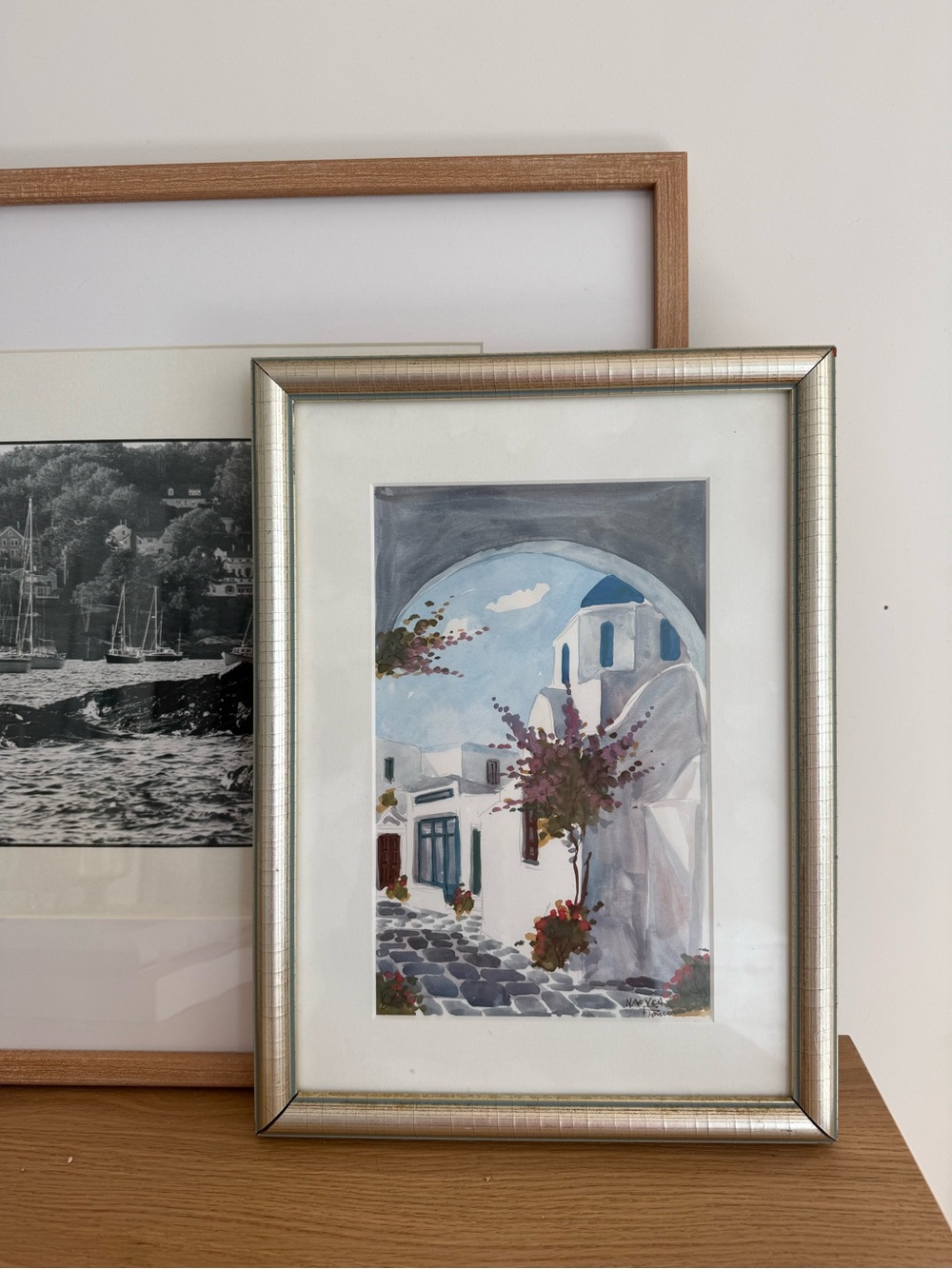 Silver-framed handmade coastal village watercolor in white and blue